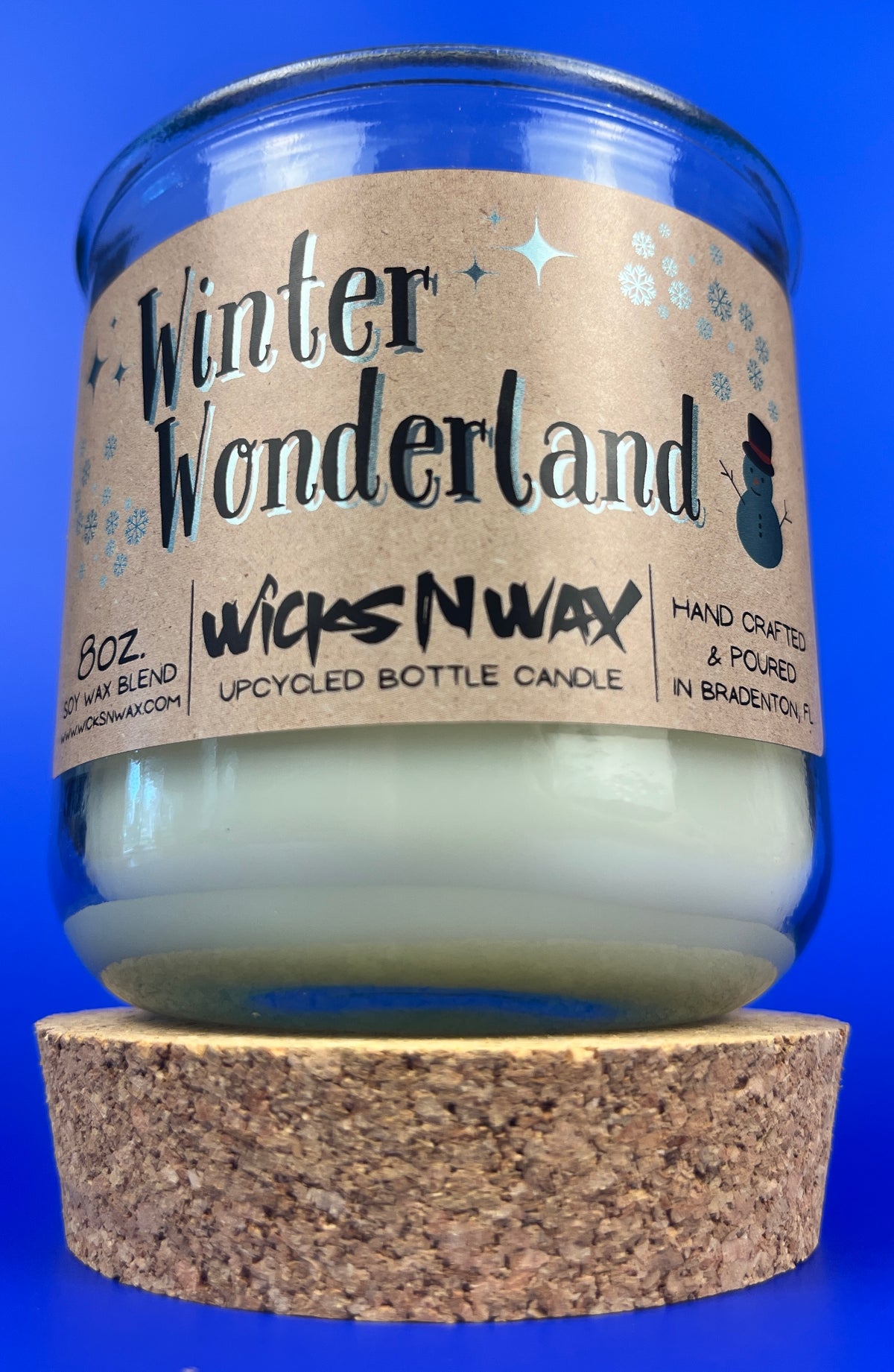 Recycled glass candle with cork base and Winter Wonderland label on clear jar